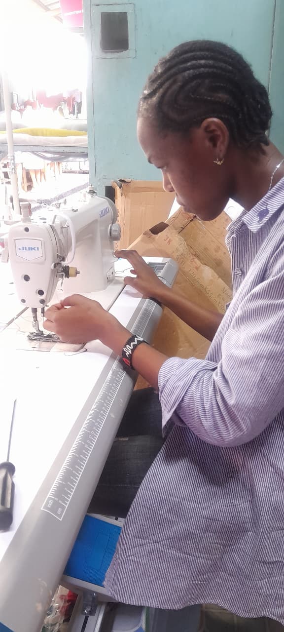 Trainee at a sewing machine